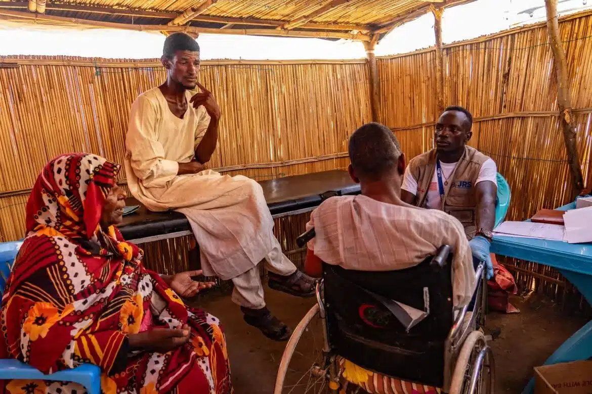 A worker with Jesuit Refugee Service is seen in a 2023 photo offering physical therapy to a woman in Renk, South Sudan, as part of the response to the conflict in Sudan. A pause on U.S. foreign aid is affecting critical programs carried out by nongovernmental organizations like JRS. (OSV News photo/courtesy JRS)