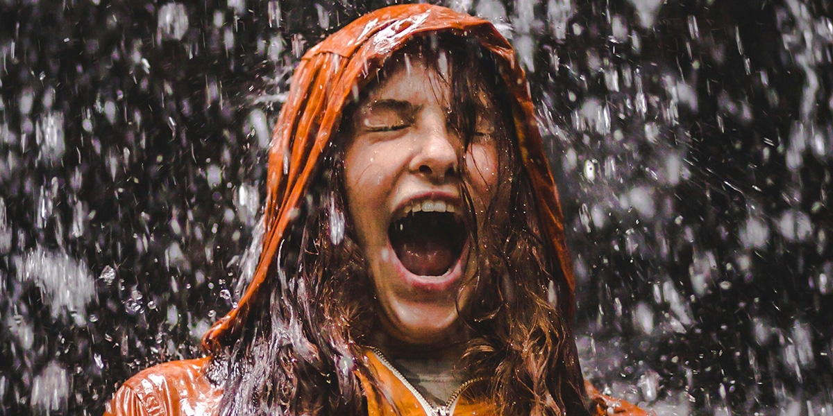 girl getting wet from rain
