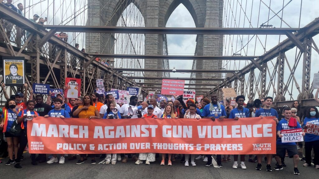 People in New York City cross the Brooklyn Bridge June 11, 2022, as they participate in the March for Our Lives rally, one of a series of nationwide protests against gun violence. CNS photo/Eric Cox, Reuters)
