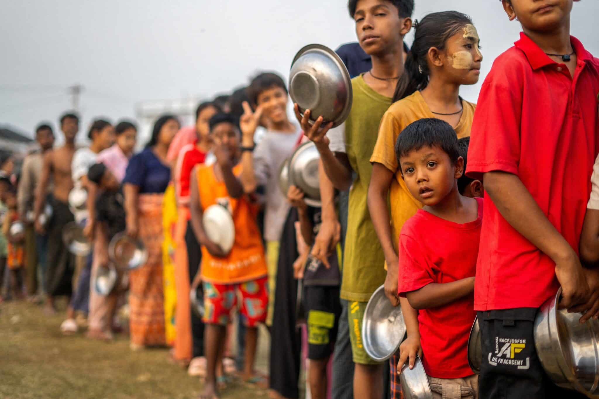 Displaced people wait in line for food and relief supplies in Amarapura, Myanmar, April 1, 2025, following a 7.7 magnitude earthquake that hit midday March 28. As the death toll following the massive earthquake is expected to reach at least 3,000, humanitarian organizations in the region, like Catholic Relief Services, are working round the clock to get essential supplies to those in need. (OSV News photo/Reuters)