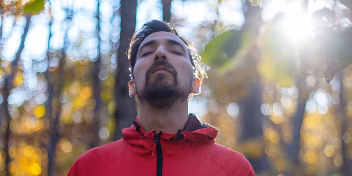 man taking a deep breath