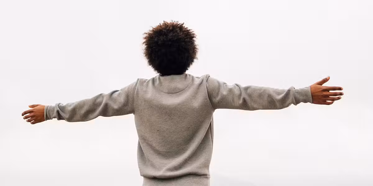 man praising God with hands raised.