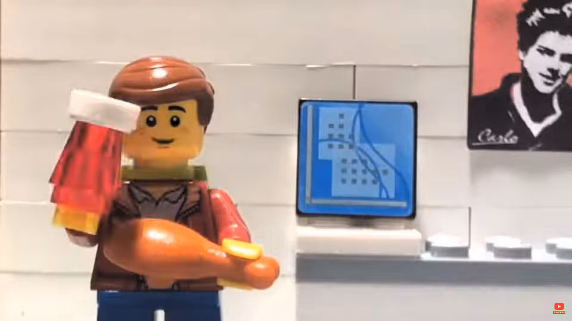 Blessed Carlo Acutis stands near his computer in a scene from a stop-motion animation Lego-Carlo Acutis film made by three brothers in County Limerick, Ireland, and released in mind-May 2025 on their YouTube channel, Fiontar Floinn. To the right in the background is a photo of Carlo (1996-2006).