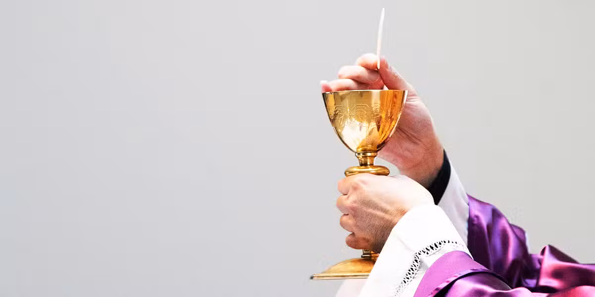 Priest, eucharist in a church