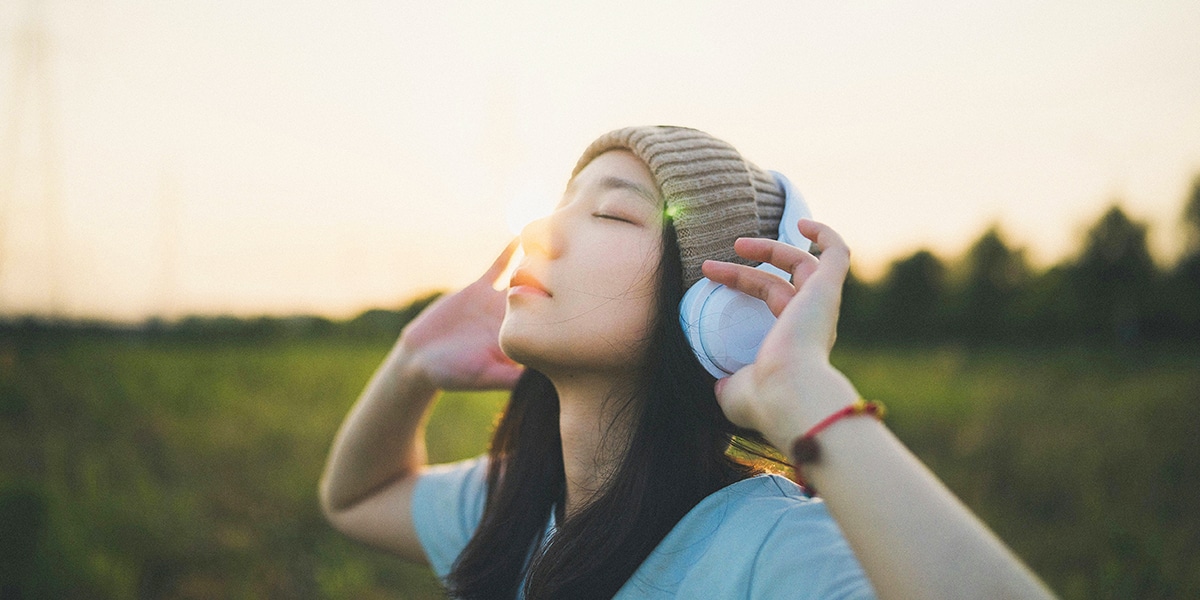 woman wearing headphones, enjoying silence