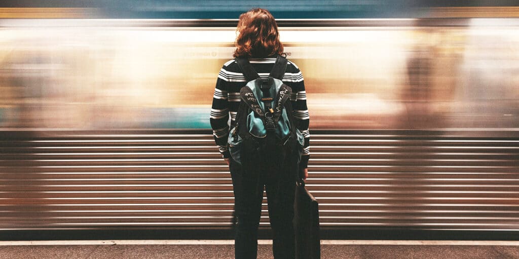 A woman waiting for a train.