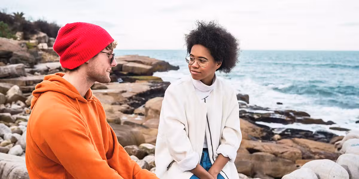 two people talking and listening.