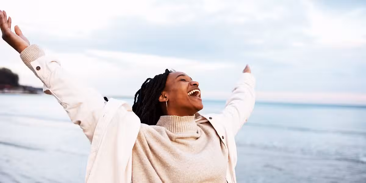 Woman experiencing joy and laughing.