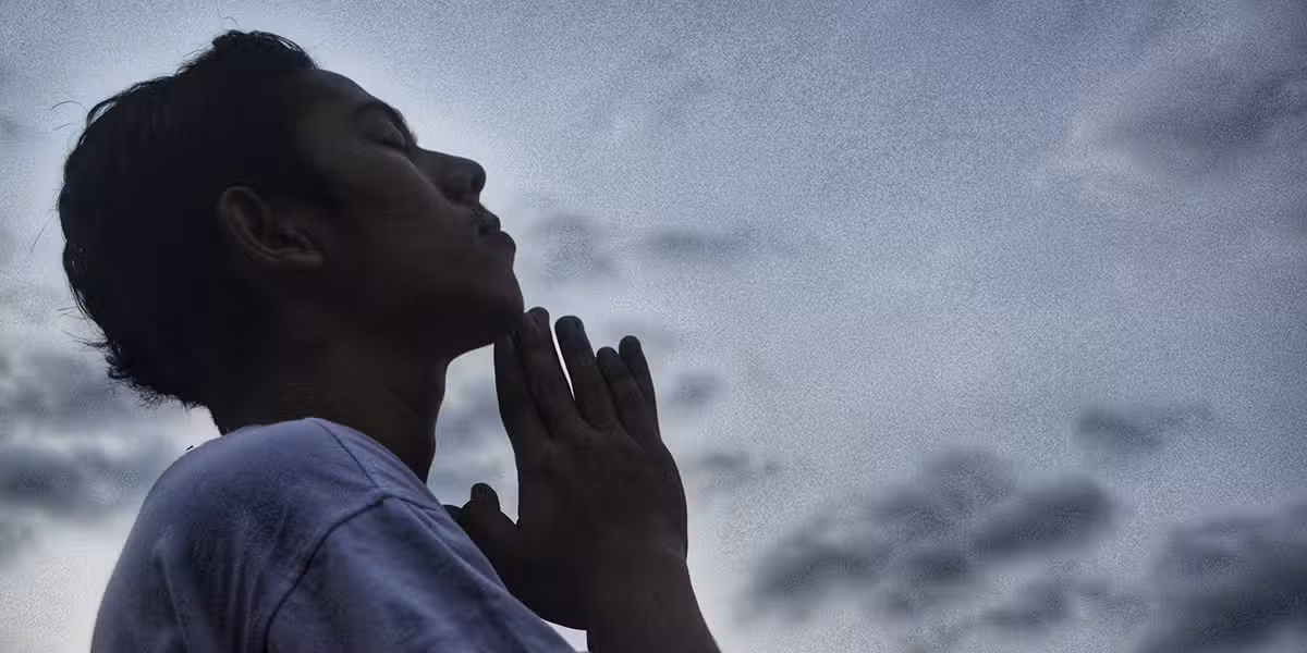 man praying in silence