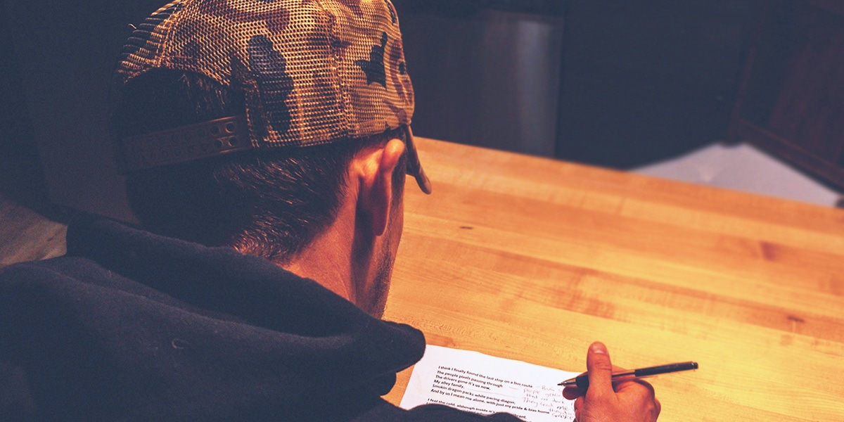 Man putting his signature on a petition