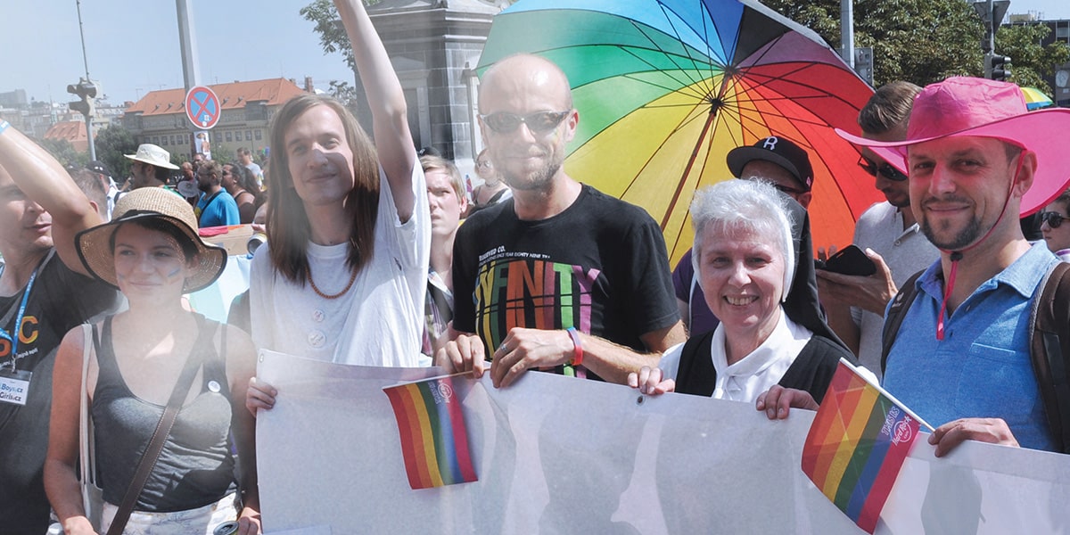Sister Jeannine Gramick, SL (standing on the right), marches with LGBTQ Catholics in a pride parade in Prague, Czech Republic.