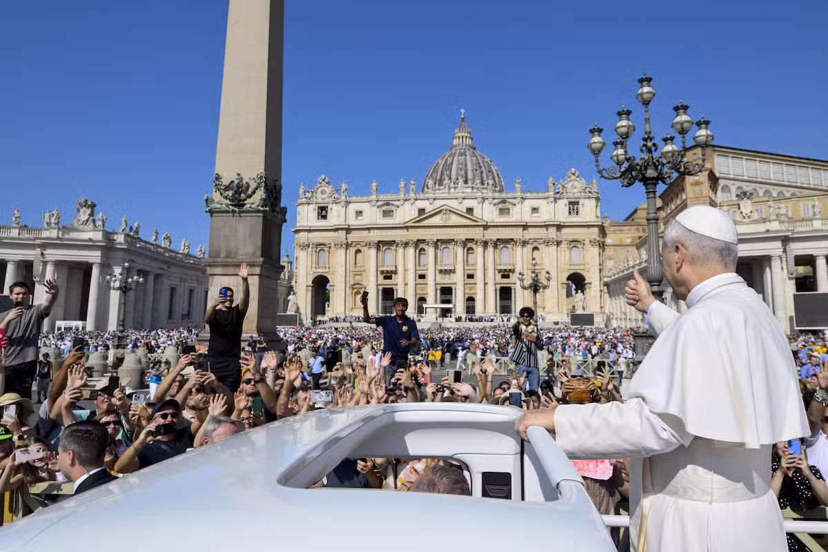 Pope Leo XIV gives a thumbs-up as he rides the popemobile around St. Peter's Square at the Vatican before his weekly general audience Aug. 6, 2025. (CNS photo/Vatican Media)