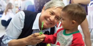 Sister Norma Pimentel plays with a child