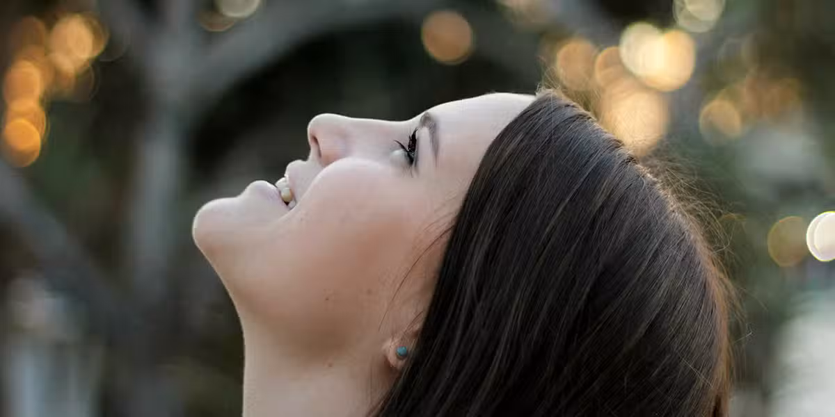woman looking into to sky content.