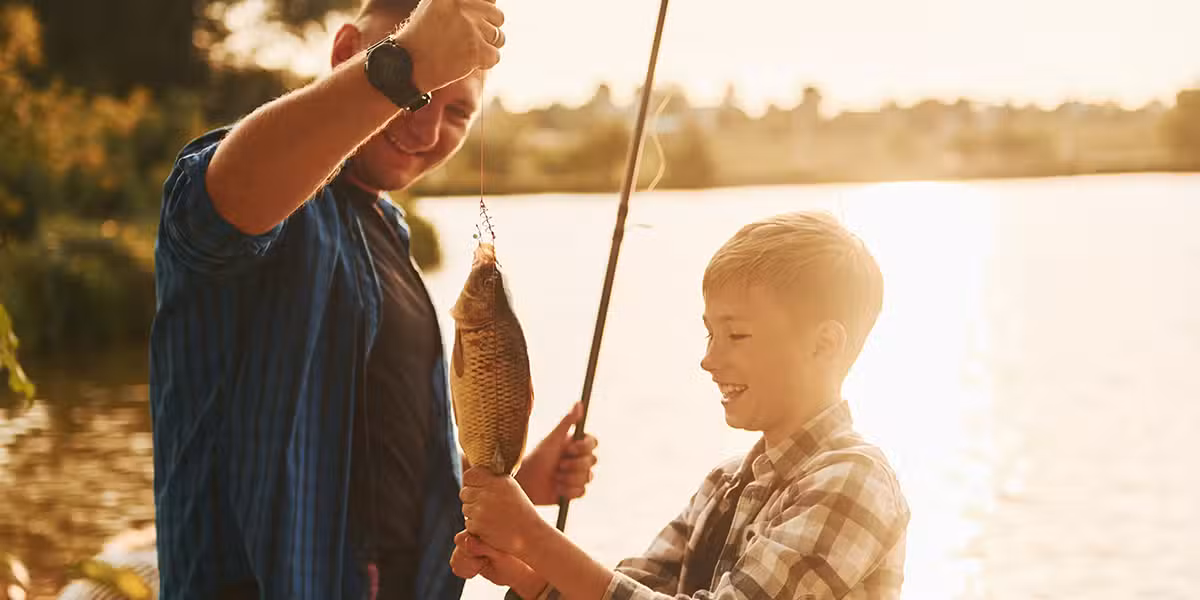 Father and son fishing together.