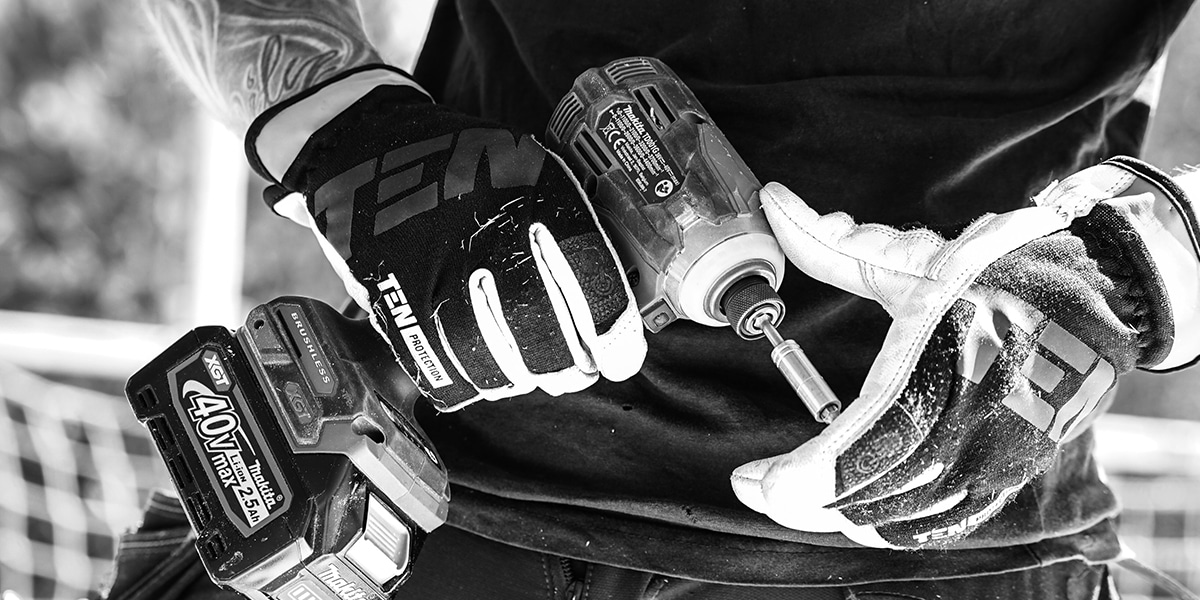 hands holding a drill ready to be used.