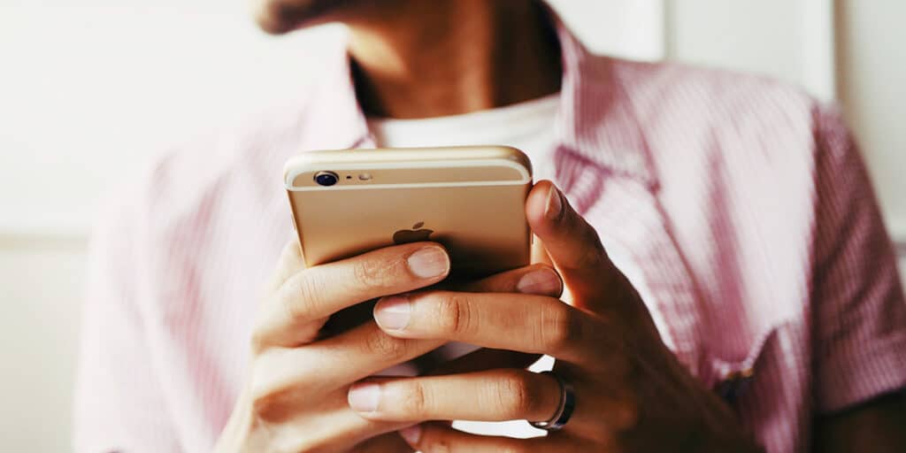 Person holding a smart phone.