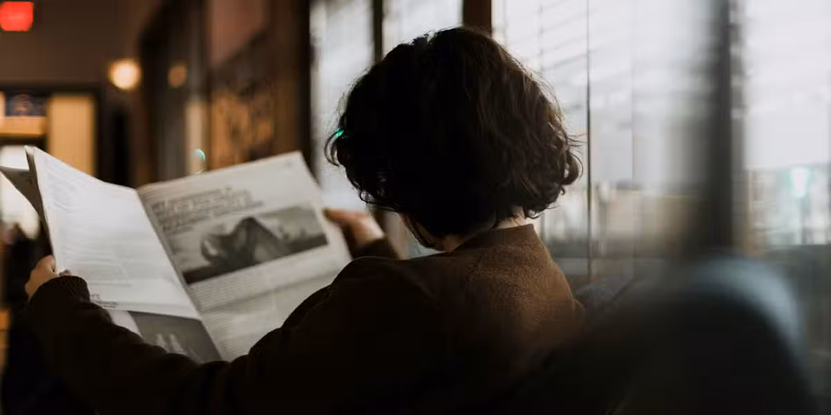 woman reading the newspaper