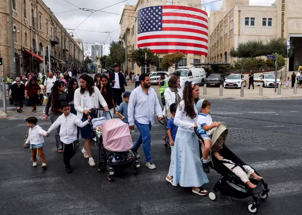 People hold placards with pictures of hostages who were kidnapped in the deadly Oct. 7, 2023, attack by Hamas, after a ceasefire between Israel and Hamas in the Gaza Strip went into effect, at "Hostages Square" in Tel Aviv, Israel, Oct. 11, 2025. (OSV News photo/Ronen Zvulun, Reuters)