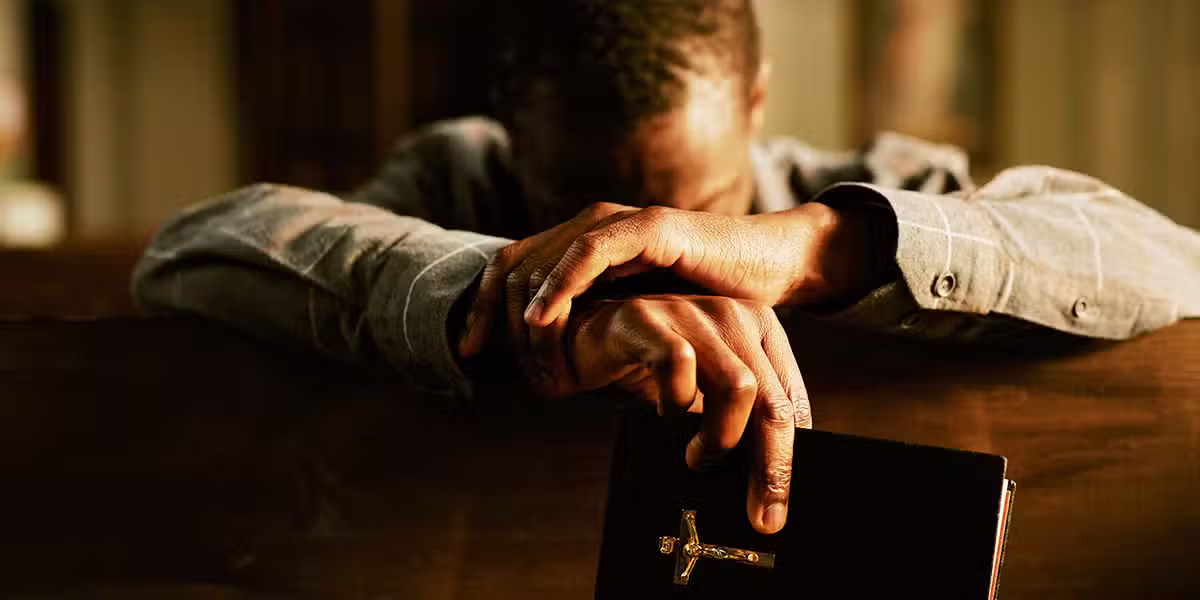 person praying and repenting