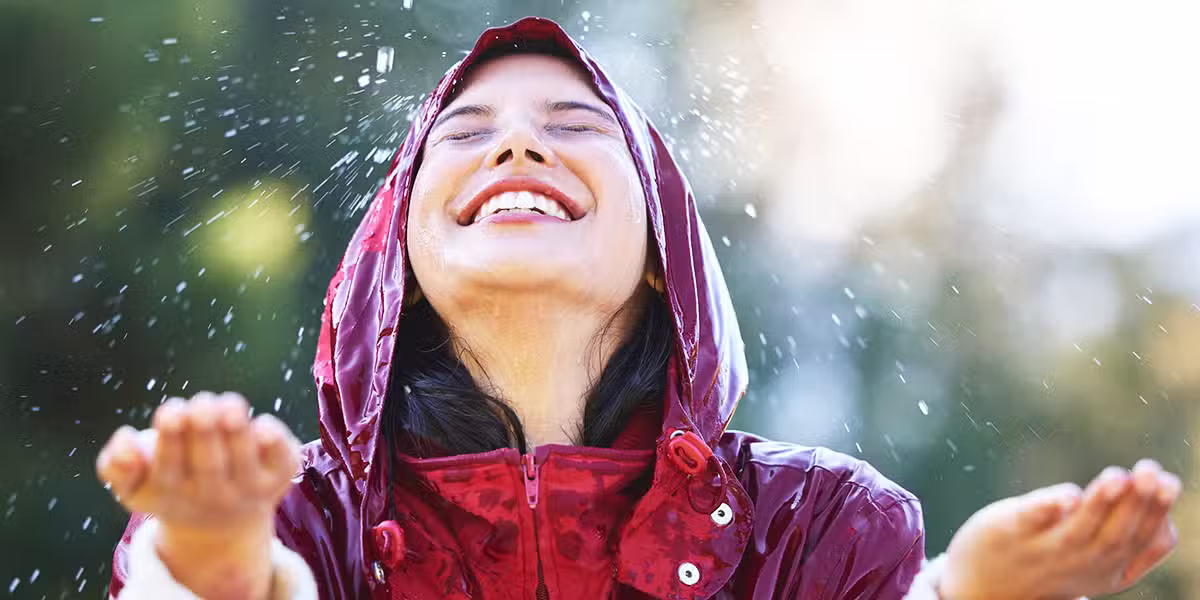 person getting wet in the rain