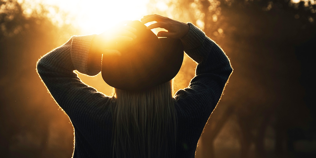 Woman looking at the sun | Photo by 7500 RPM on Unsplash