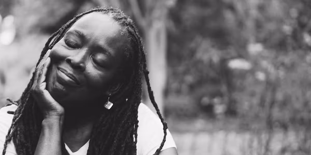 Woman thinking about divine creativity | Photo by Eye for Ebony on Unsplash