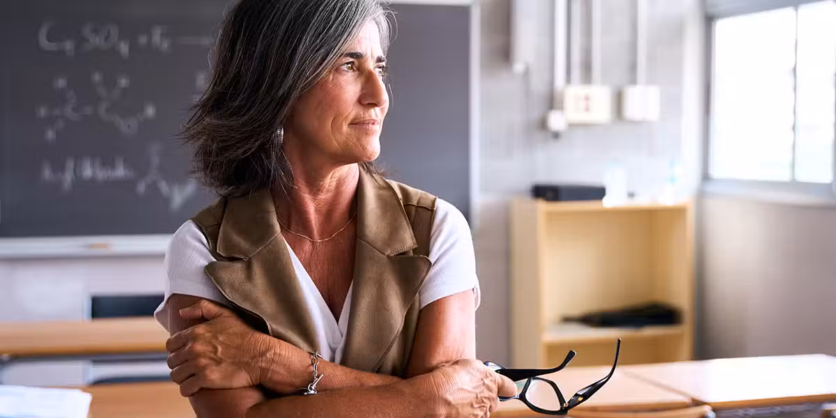 female teacher in a classroom at a school.
