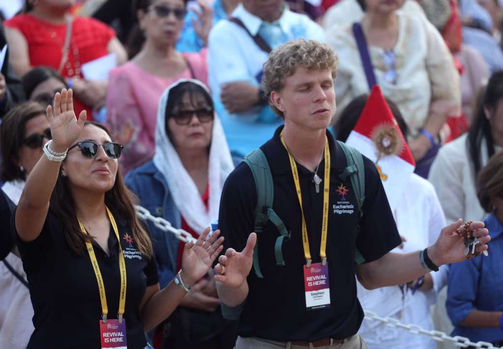 Young people pray near a monstrance after a Mass for the feast of Corpus Christi at the Cathedral of Our Lady of the Angels in Los Angeles June 22, 2025, during the National Eucharistic Pilgrimage. (OSV News photo/Bob Roller)