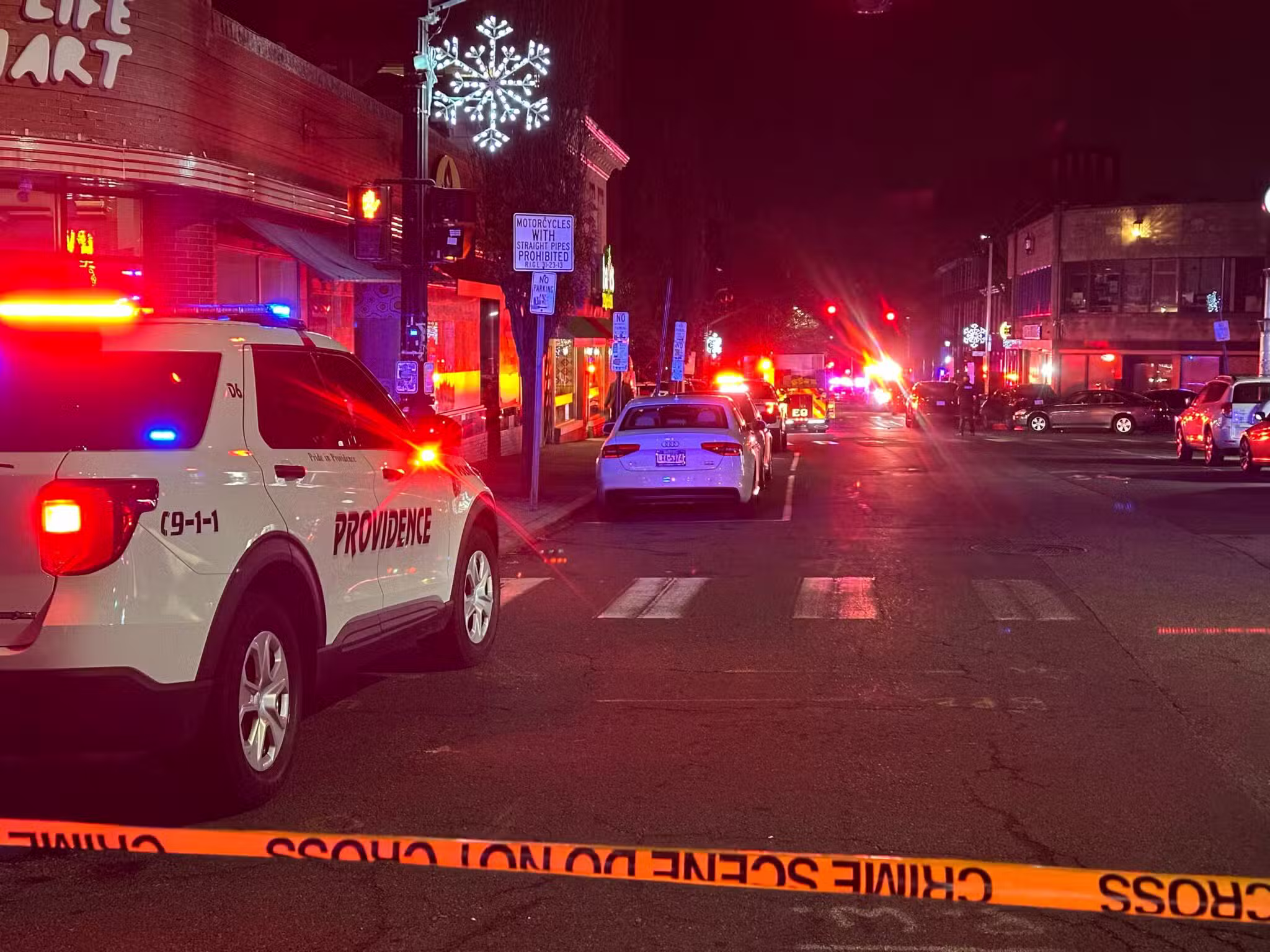 A police vehicle stands near the site of a mass shooting reported by authorities at Brown University in Providence, R.I.,