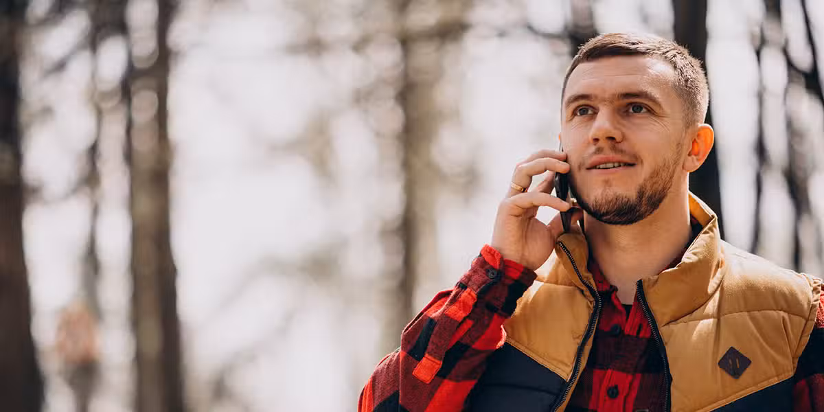 outgoing call; man making a phone call outside during the winter