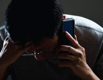 anguished-man-talking-on-a-cell-phone