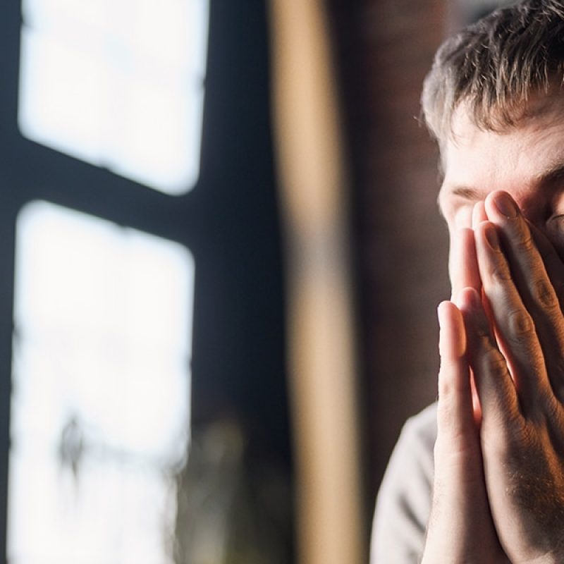anxious person praying