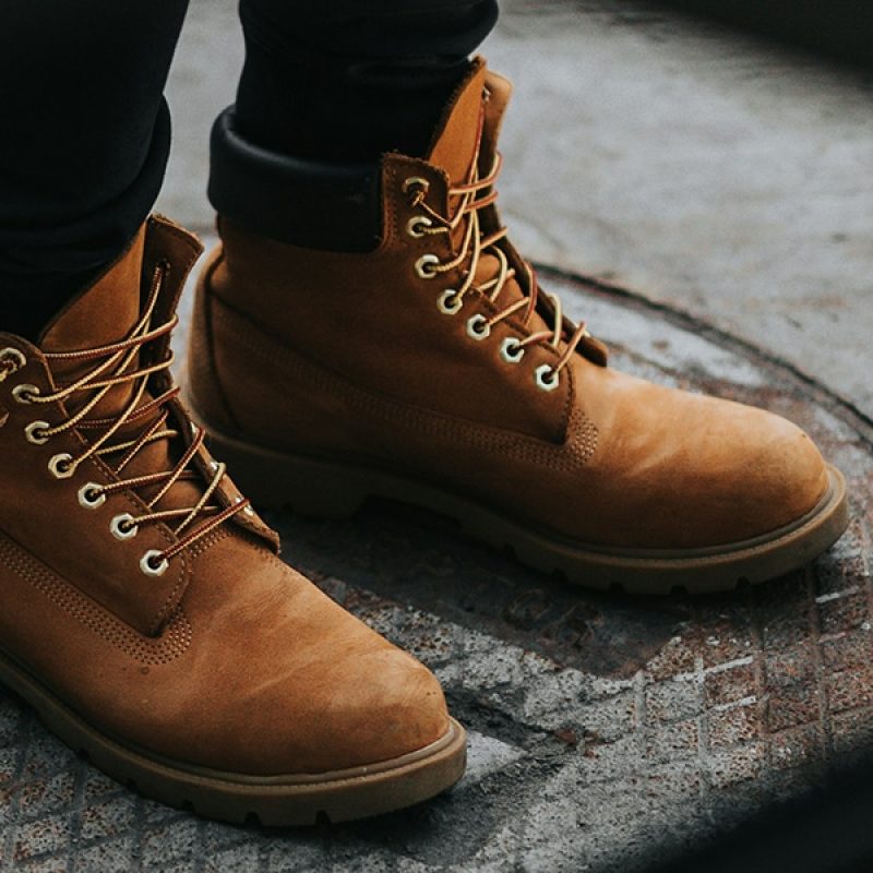 person wearing boots standing in the center of a circle