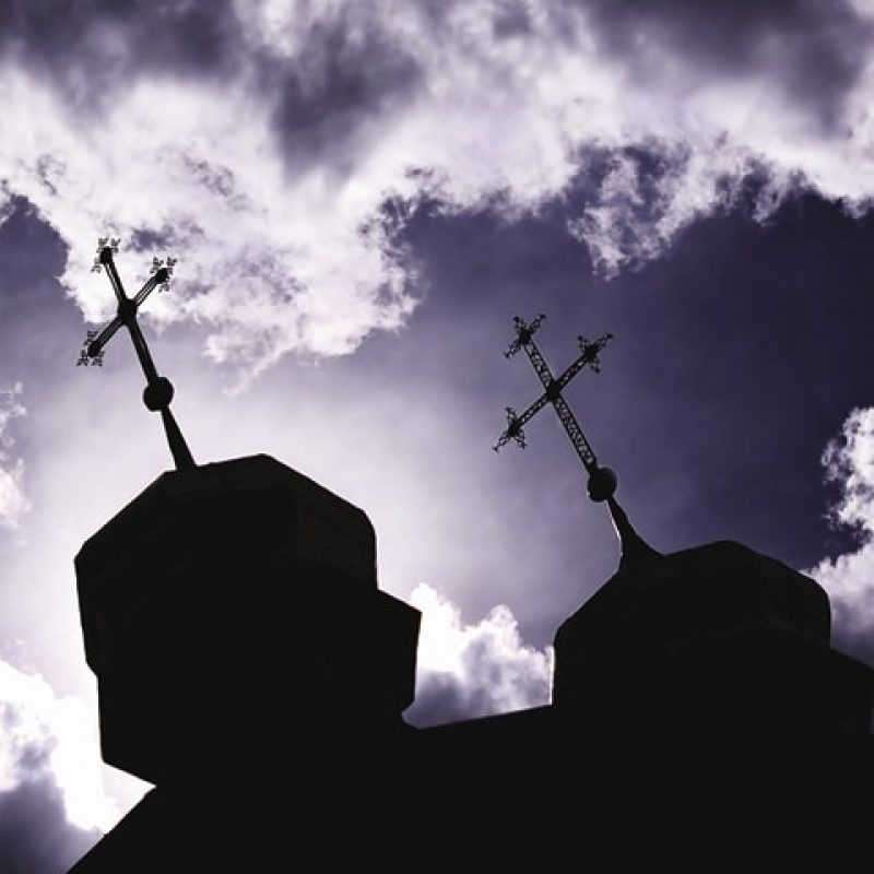 Church steeples with the sky in the background