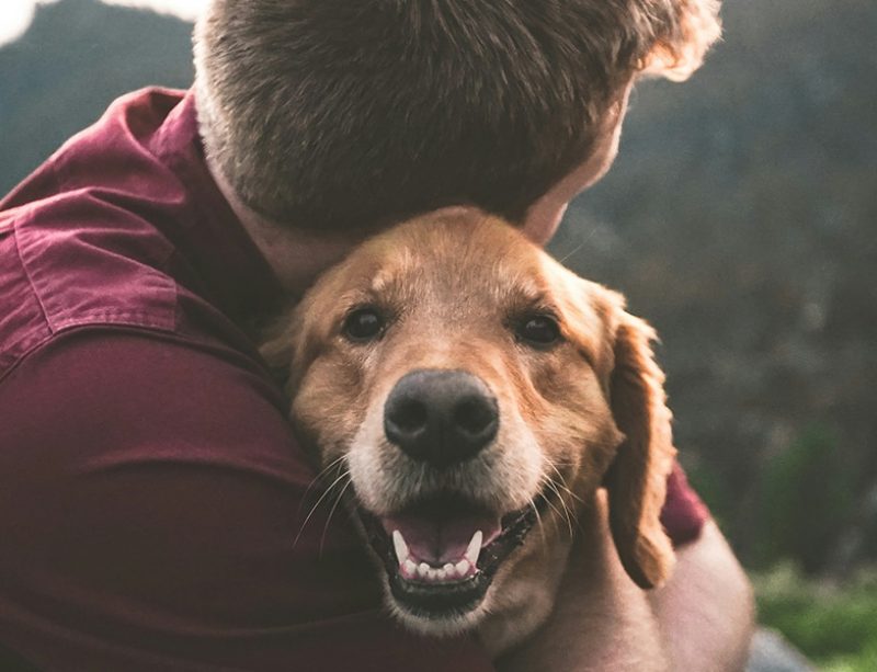 man holding his dog