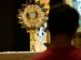 person adoring eucharist on the altar