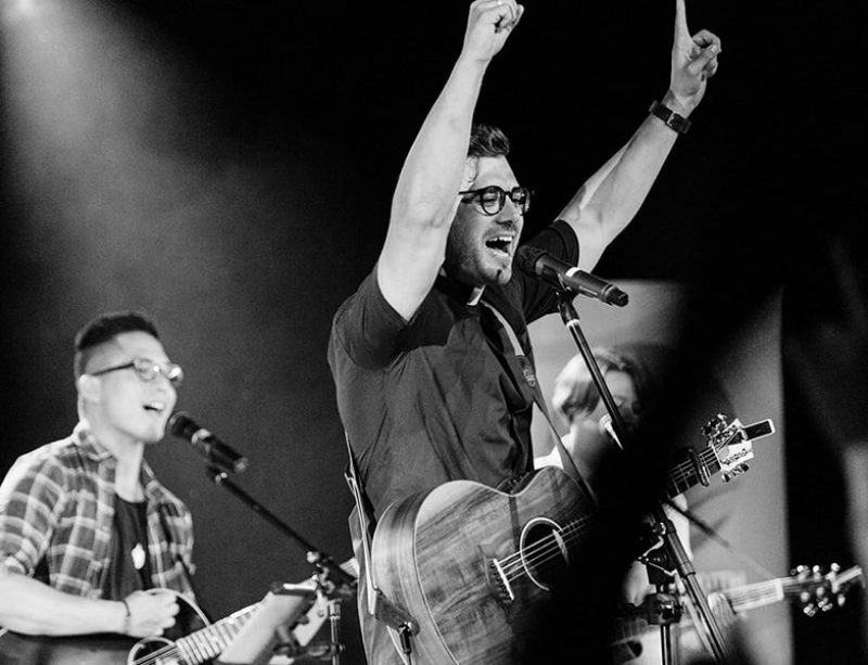 Father Rob Galea performing a concert