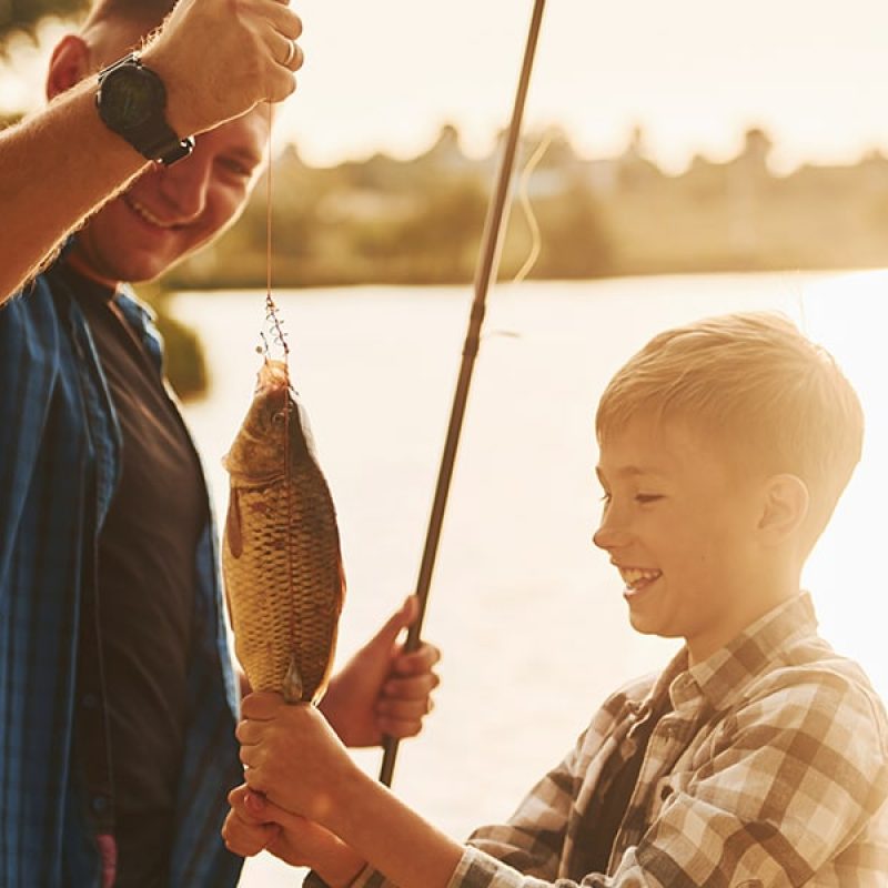 Father and son fishing together.