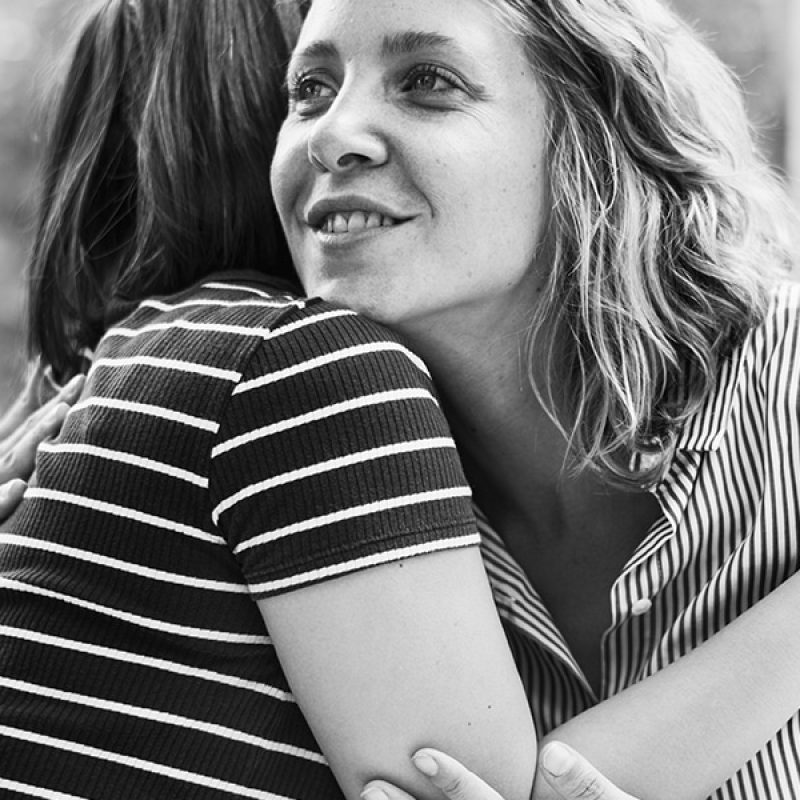 two friends hugging, showing kindness and appreciation for each other.