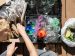 gather the fragments; person repurposing recycled material