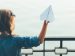 Girl enjoying a paper airplane