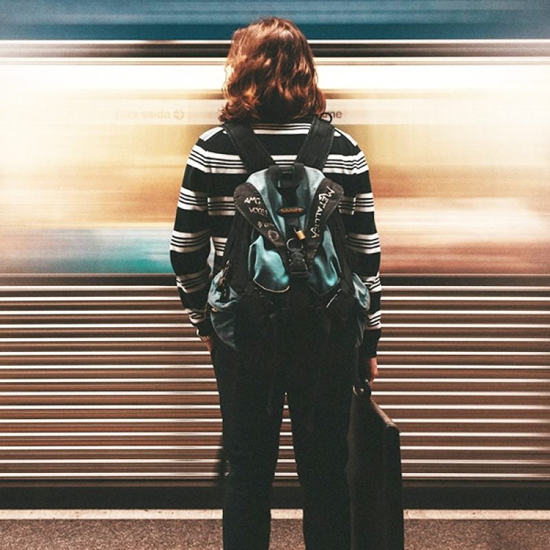 A woman waiting for a train.