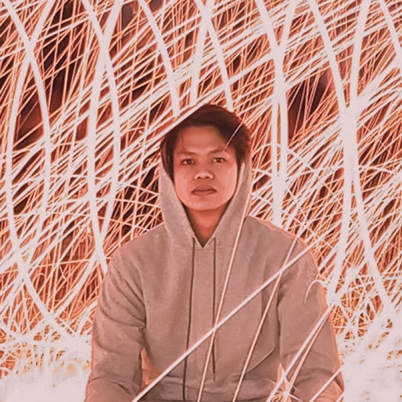 good news in chaos; man sitting still in front of light movement