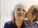 Grandson kissing his grandmother