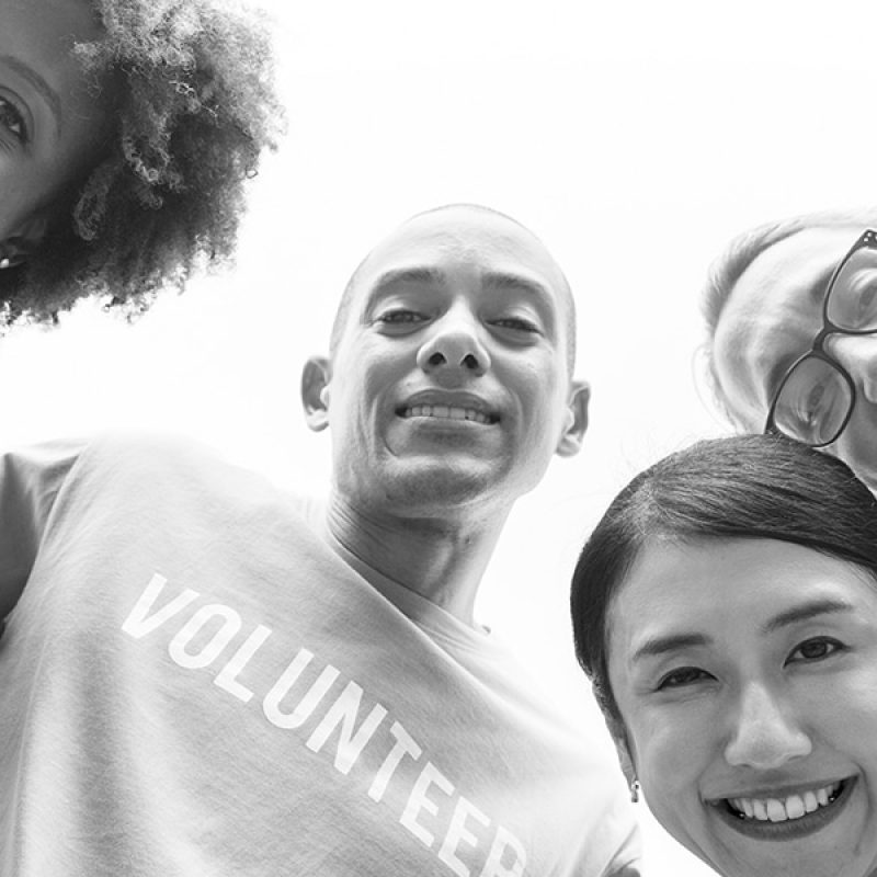 group of people wearing volunteer t-shirts