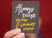 hand holding a sign with the words "always trust your inner voice"