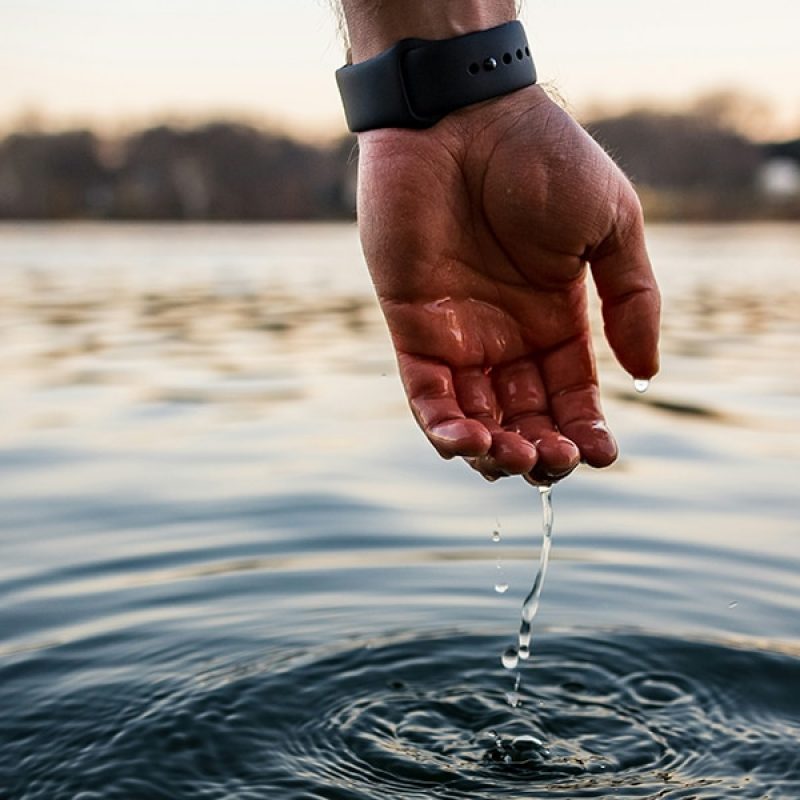 drops of water dripping from a hand dipped in water