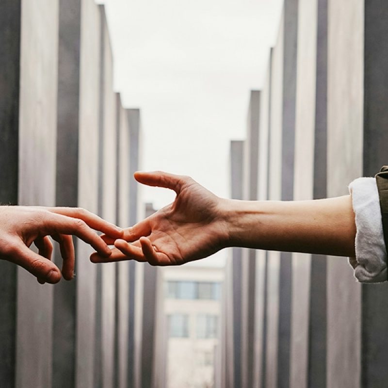 Hands reaching out | Photo by Toa Heftiba on Unsplash