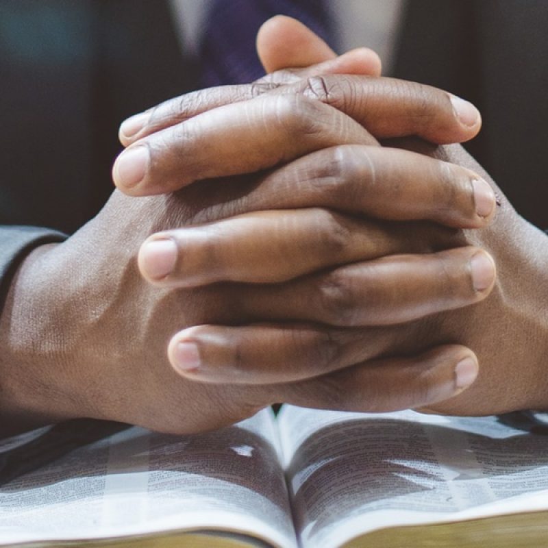 hands_folded_prayer man praying with folded hands.